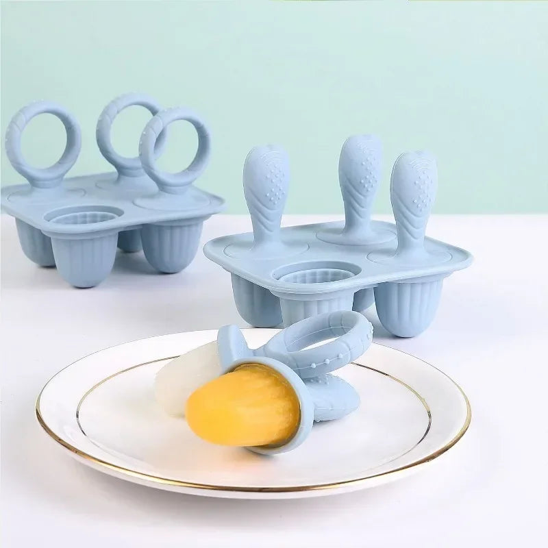Blue silicone baby fruit and vegetable teethers with rabbit design, including molds for frozen treats.