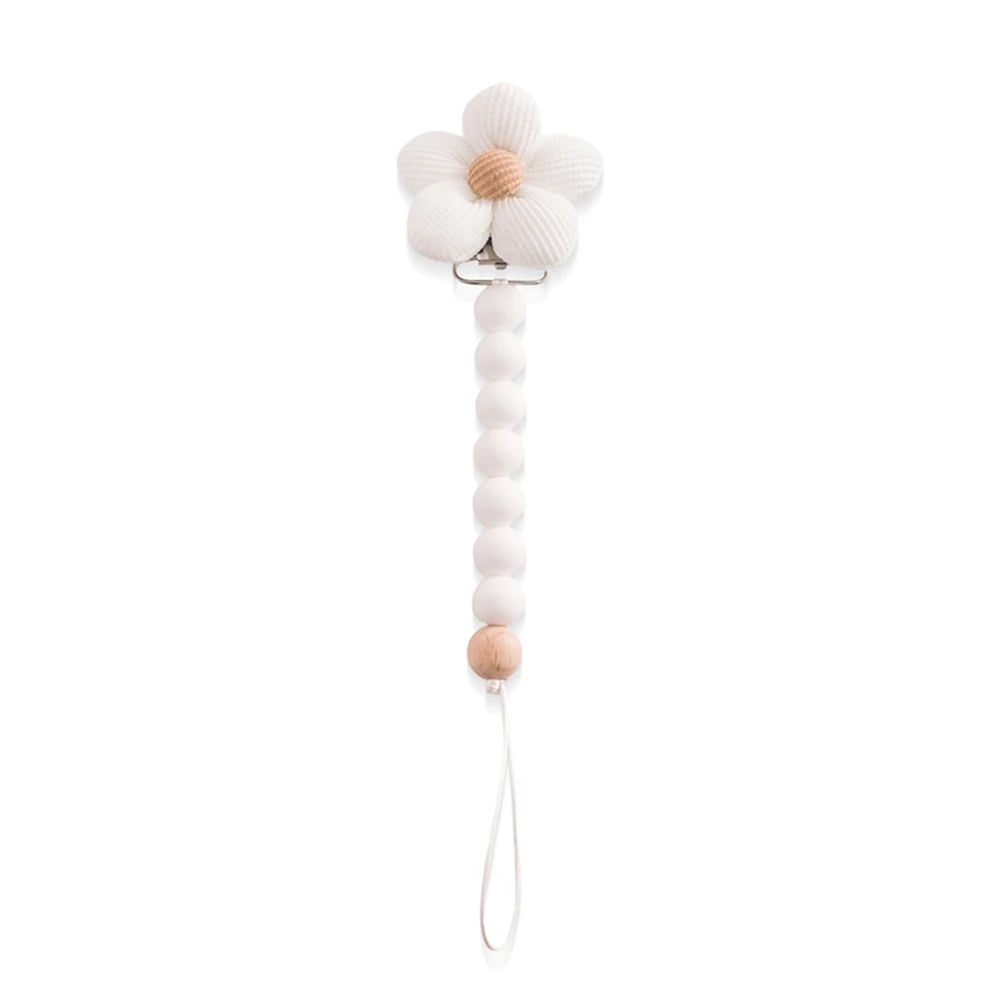 White silicone pacifier clip with a flower design and wooden bead accent.
