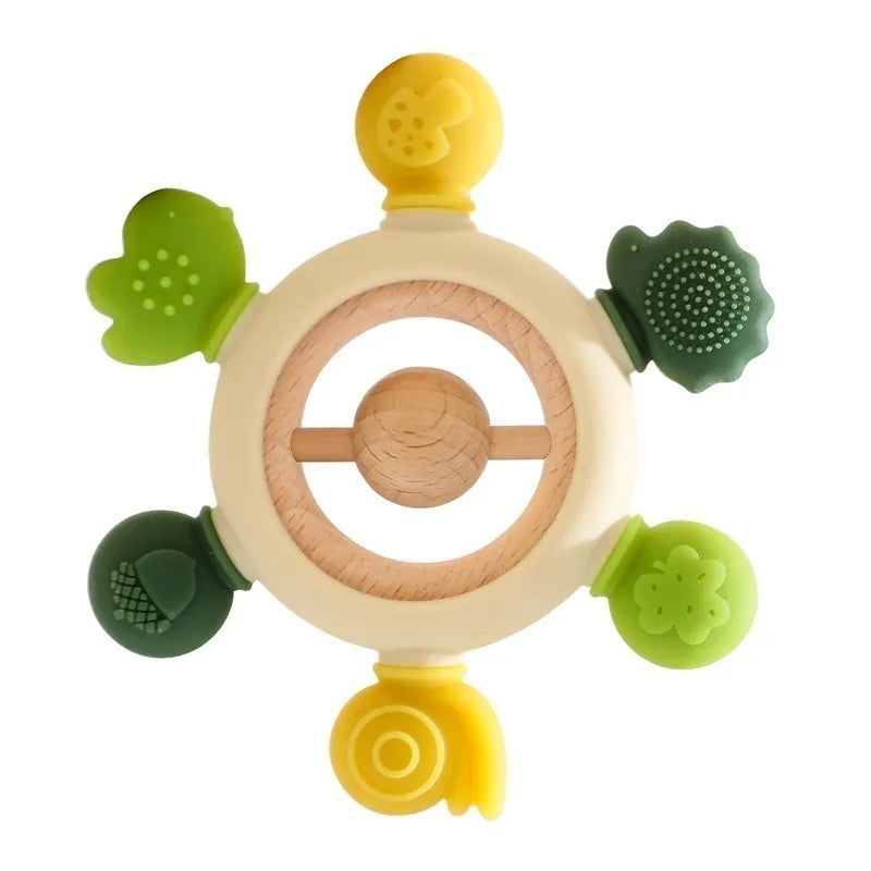 Montessori forest-themed silicone and wood baby teether with green and yellow nature shapes.