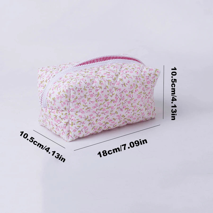 Quilted floral makeup bag with pink zipper, 18cm x 10.5cm, for travel and daily use.