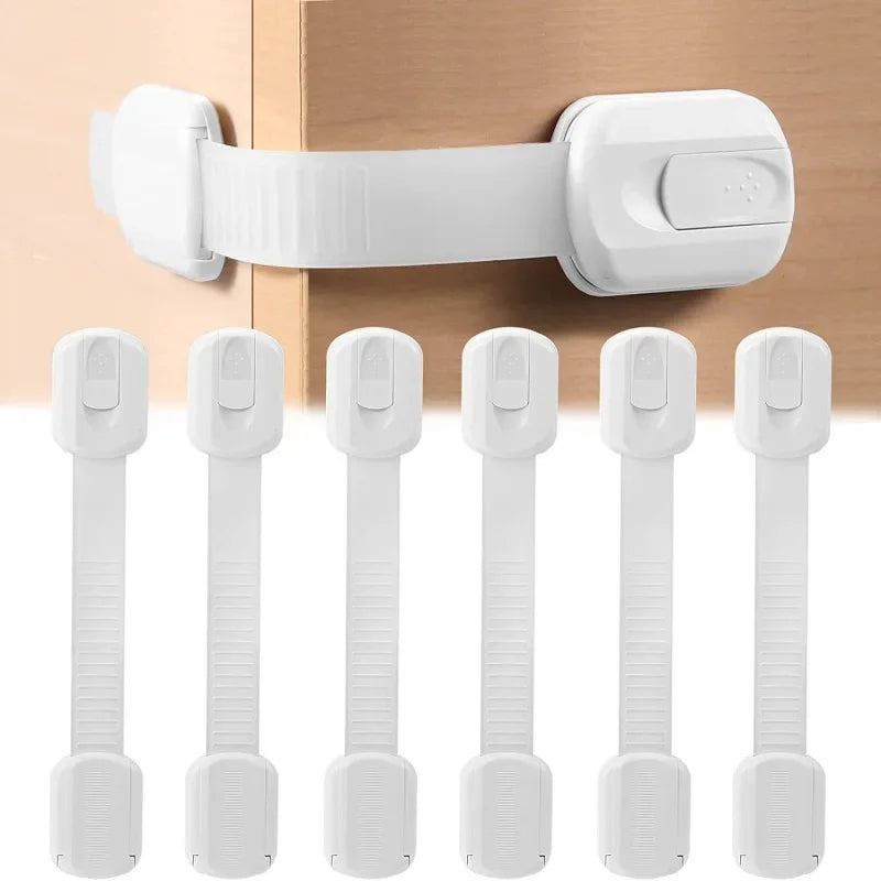White plastic child safety locks for cabinets and drawers, drill-free adhesive installation.
