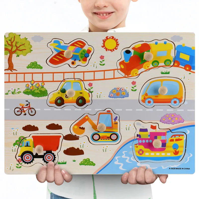 Wooden Montessori puzzle with colorful vehicle shapes and knobs, held by a child.