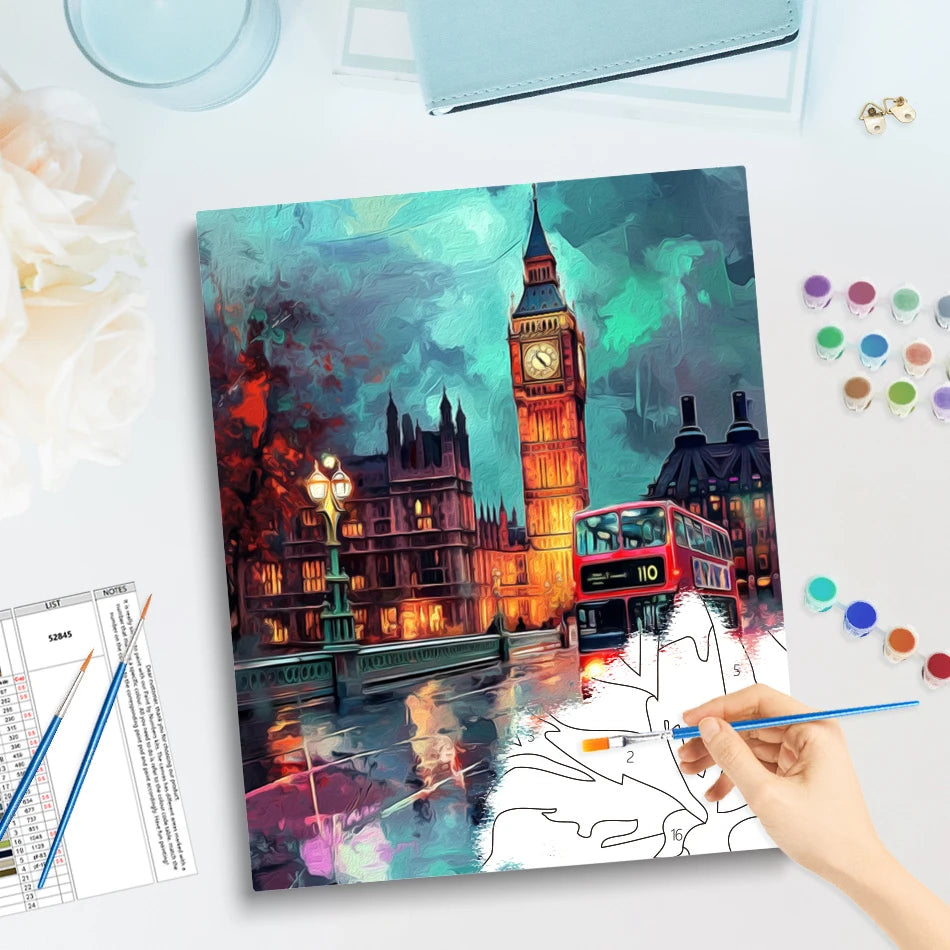 Paint by numbers kit featuring a vibrant acrylic night cityscape of London with Big Ben and a red bus.