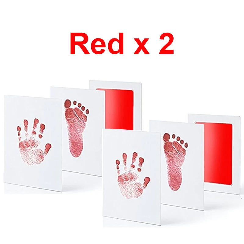 Red no-ink baby handprint and footprint kit with four white cards and two red ink pads.