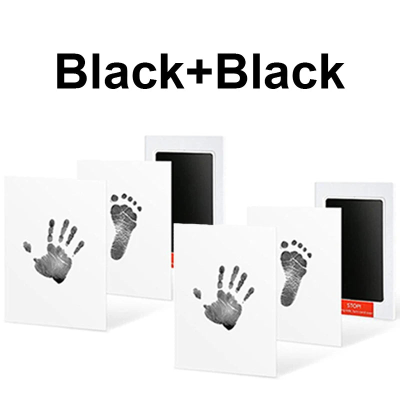 Black inkless baby handprint and footprint kit with white frames and multiple prints.