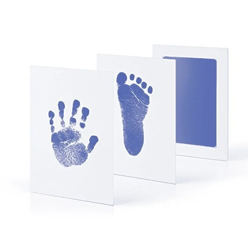 White baby handprint and footprint inkless kit with blue prints.