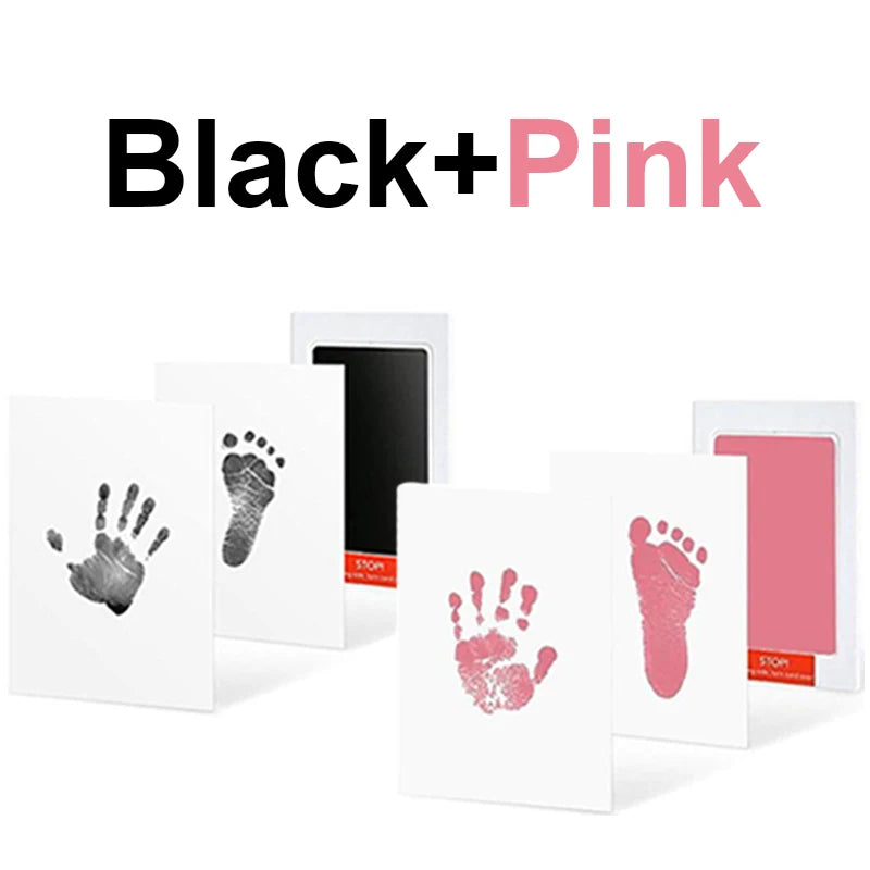 Black and pink no-touch baby hand and foot print ink pads with white cards.