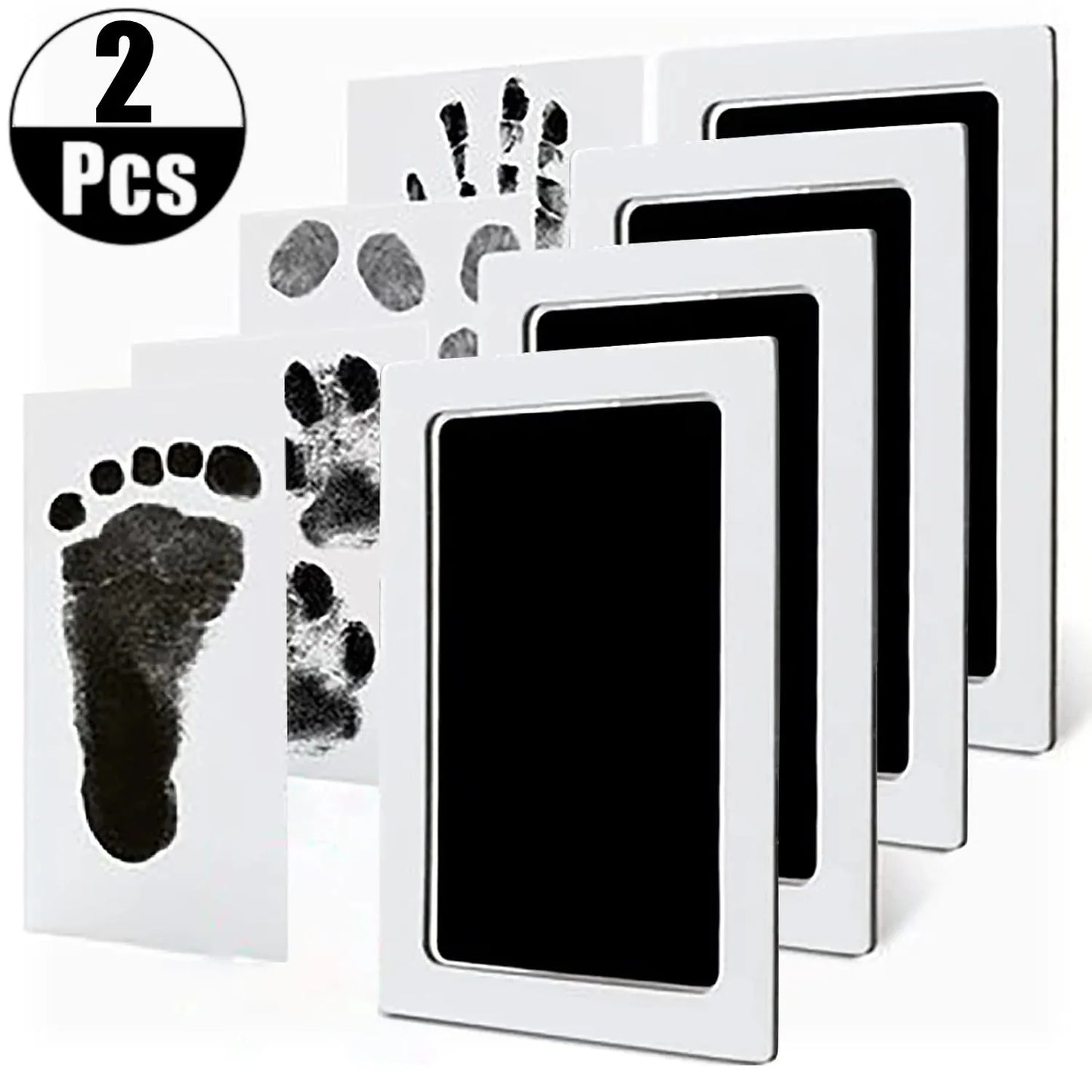 White no-touch baby handprint and footprint ink pad kit with black ink, showing two completed prints.