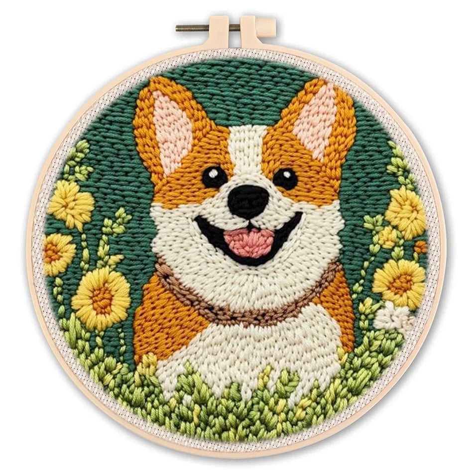 Punch needle embroidery kit featuring a smiling corgi dog surrounded by yellow flowers and green foliage in a hoop.