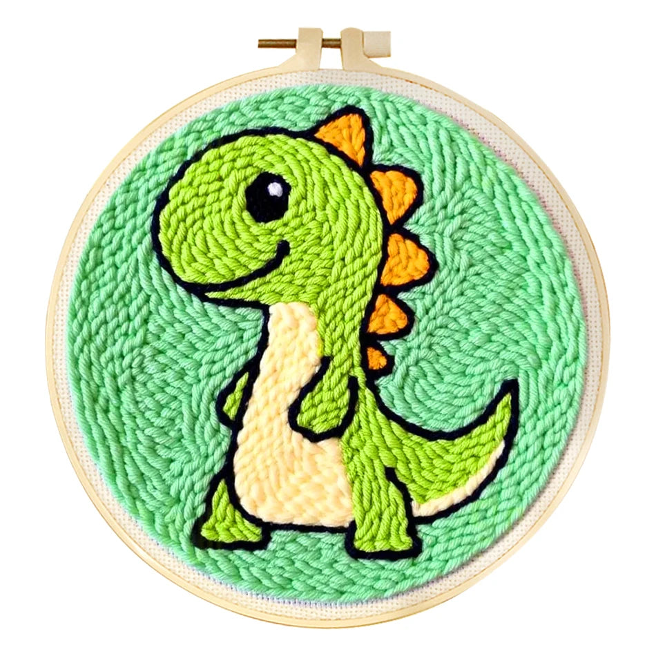 Punch needle embroidery kit with a cute green dinosaur design in a wooden hoop.