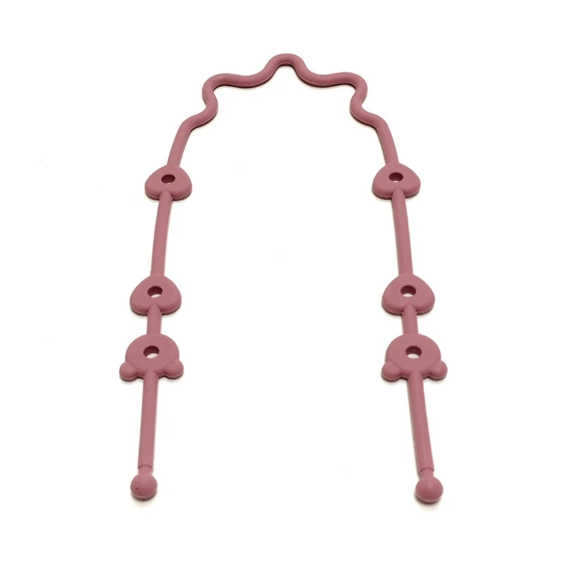Pink adjustable silicone pacifier and bottle strap with heart-shaped connectors.