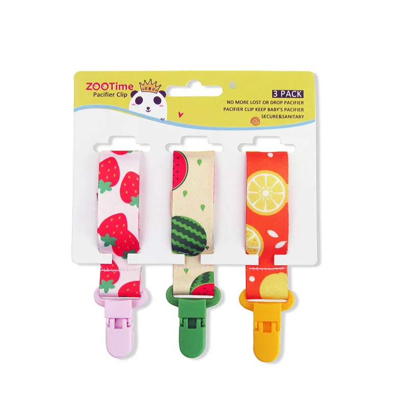 3-pack baby pacifier clips with fruit patterns: strawberry, watermelon, and lemon, featuring plastic clips.