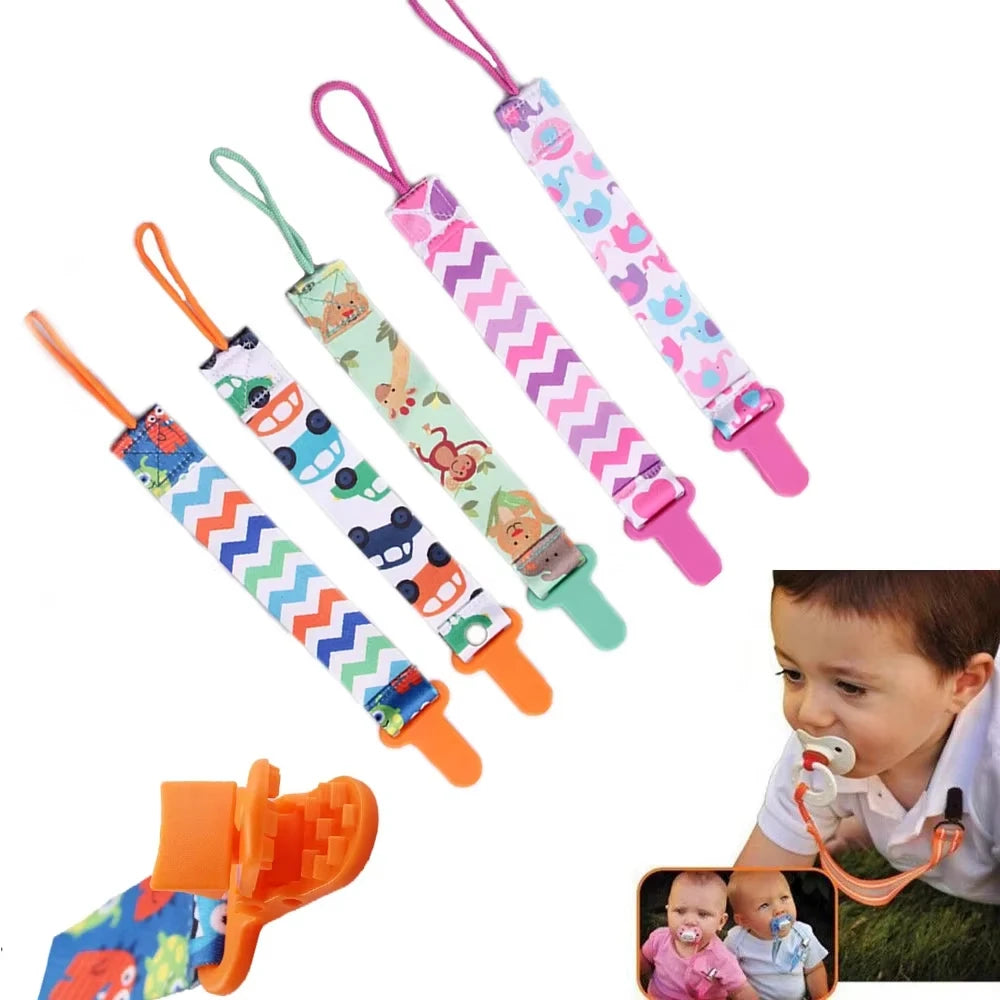 Set of 3 colorful polyester pacifier clips with plastic clasps and various baby-friendly patterns.