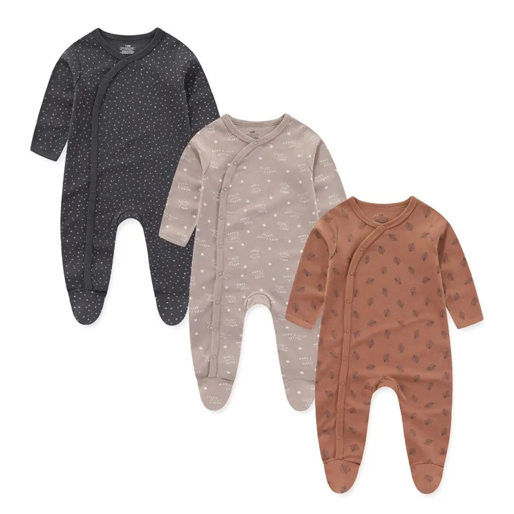 Three long-sleeve cotton baby rompers: charcoal with white dots, beige with stars, and rust with leaves.