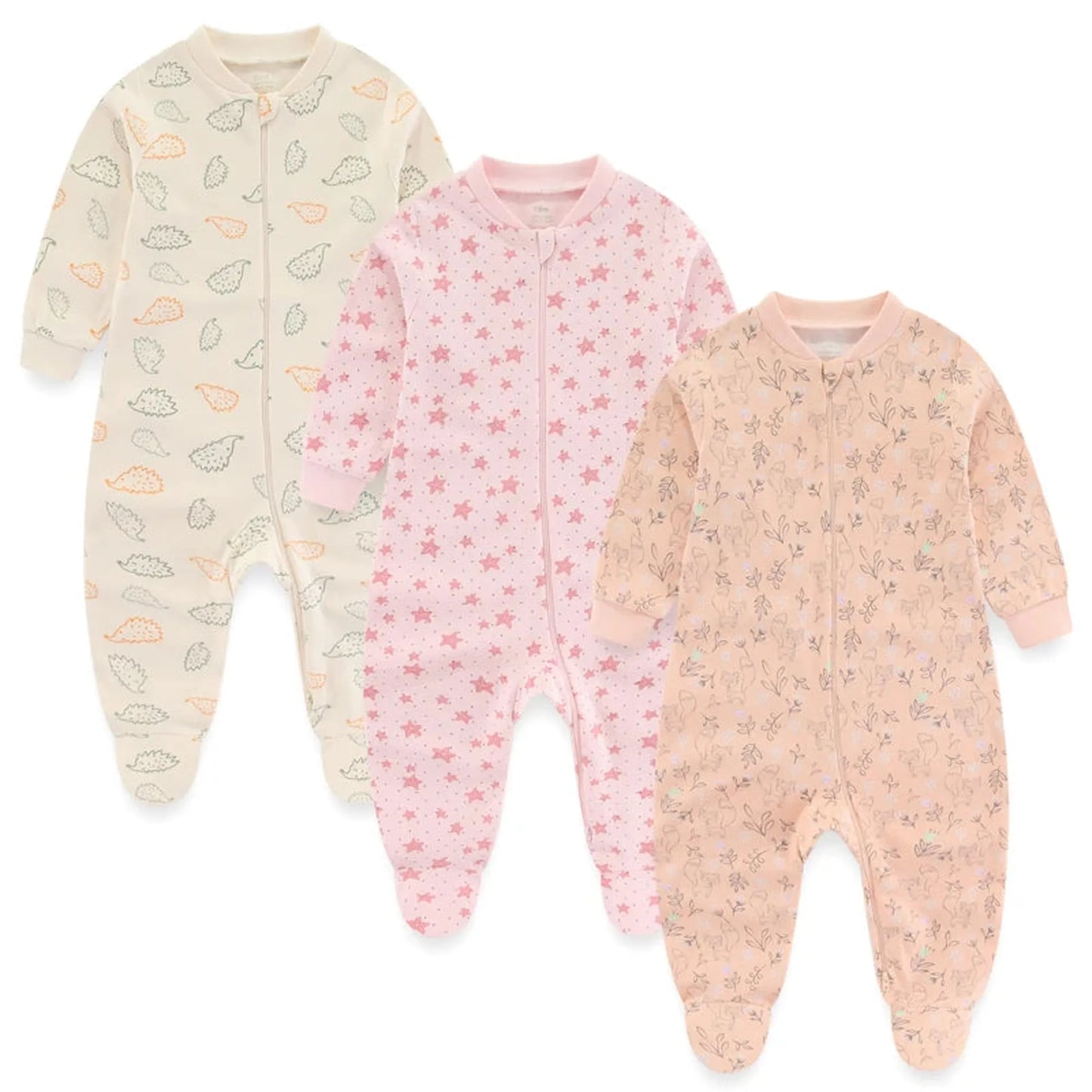 Three long-sleeve cotton baby rompers: cream with hedgehogs, pink with stars, and peach with floral patterns.