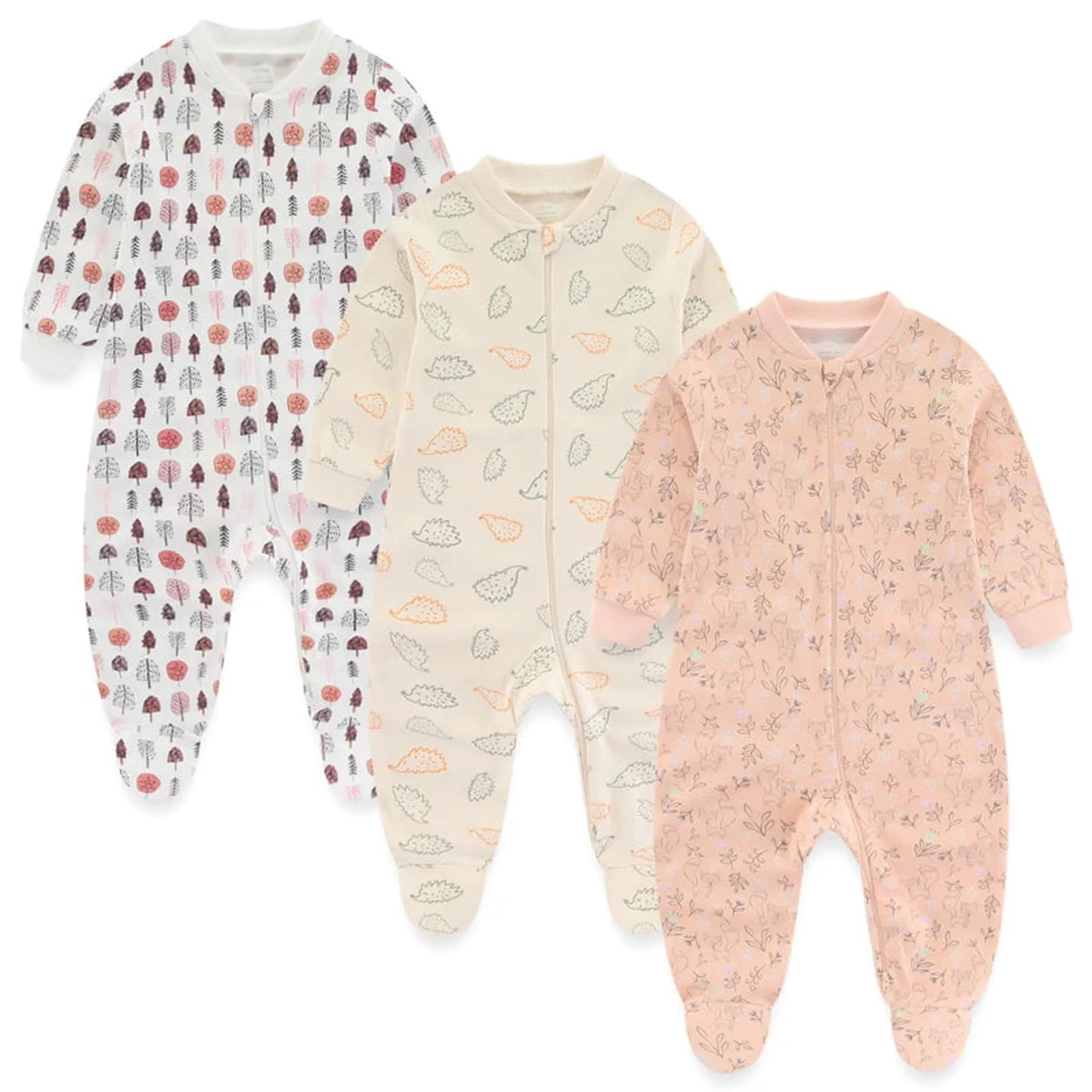 Three long-sleeve cotton baby rompers: white with trees, cream with leaves, and pink with deer.