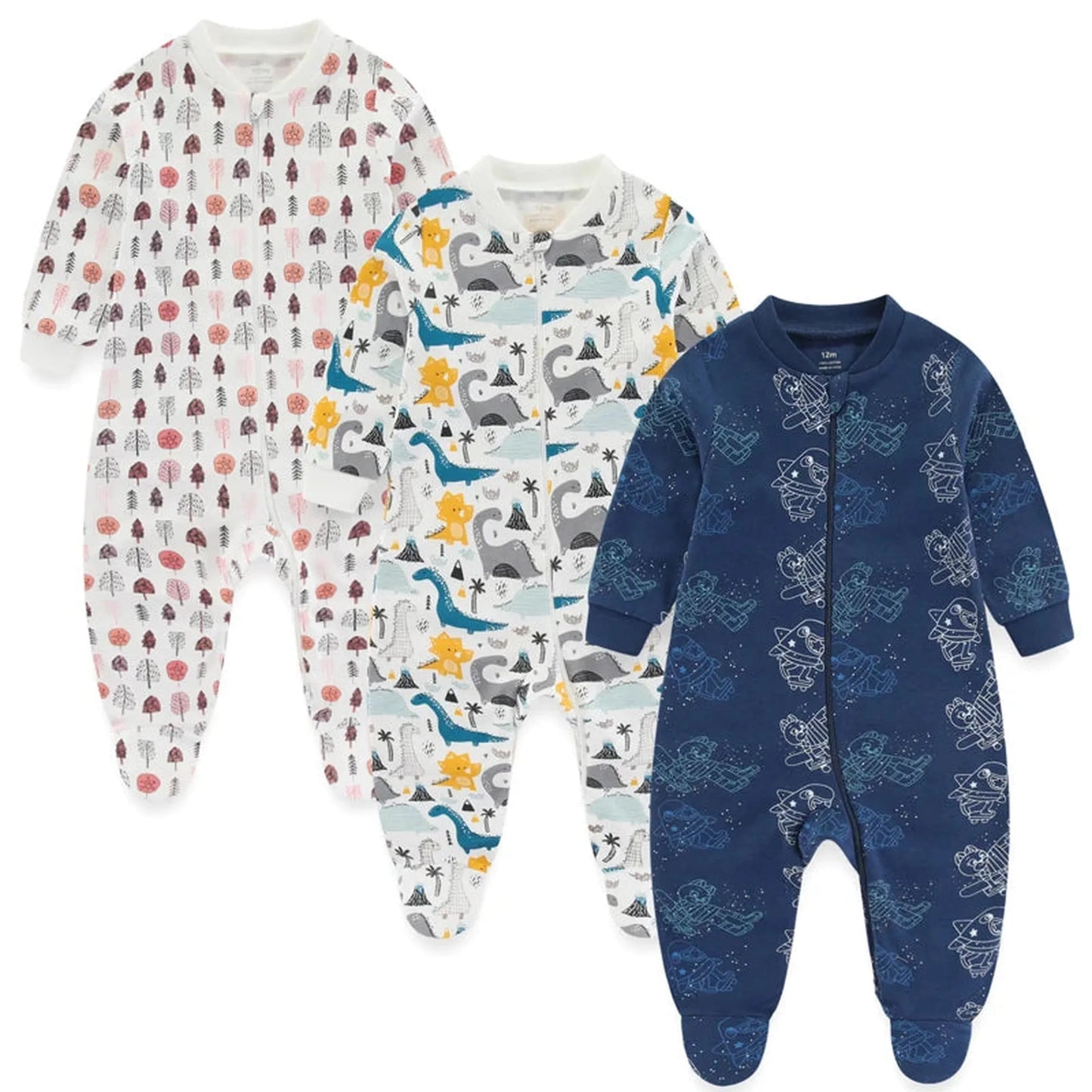 Three long-sleeve cotton baby rompers: white with trees, white with dinosaurs, and navy with astronauts.