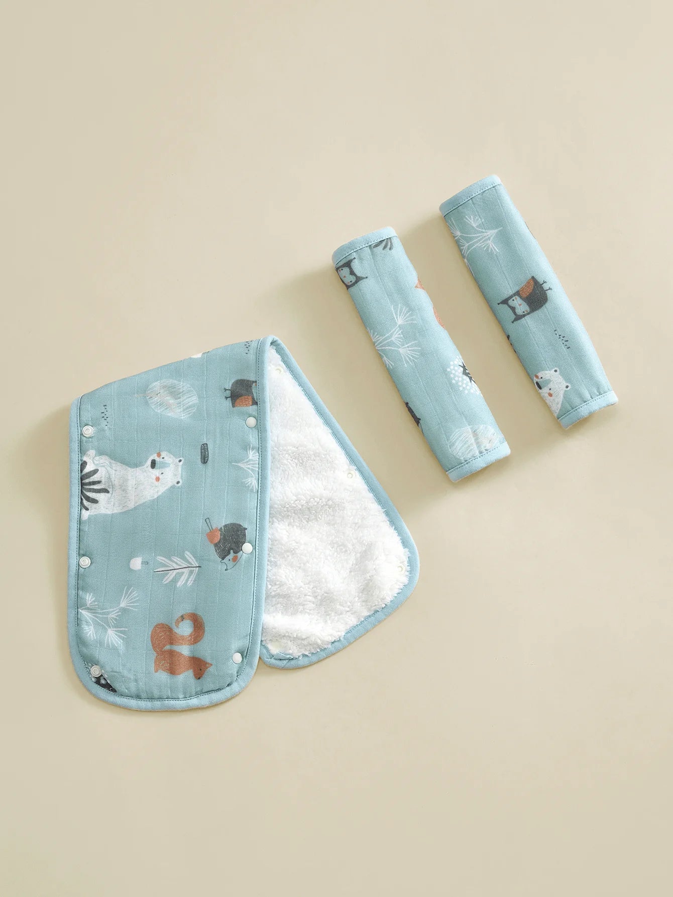 Soft blue stroller handle cover and two safety belt pads with cute animal prints.