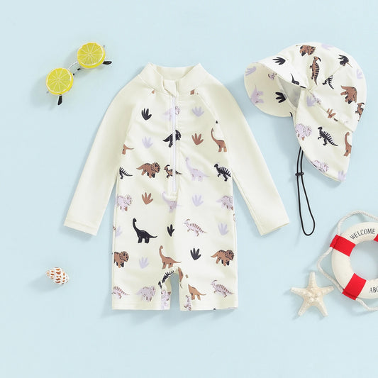 Baby long-sleeve sun protection swimsuit set in cream with dinosaur print and matching hat.