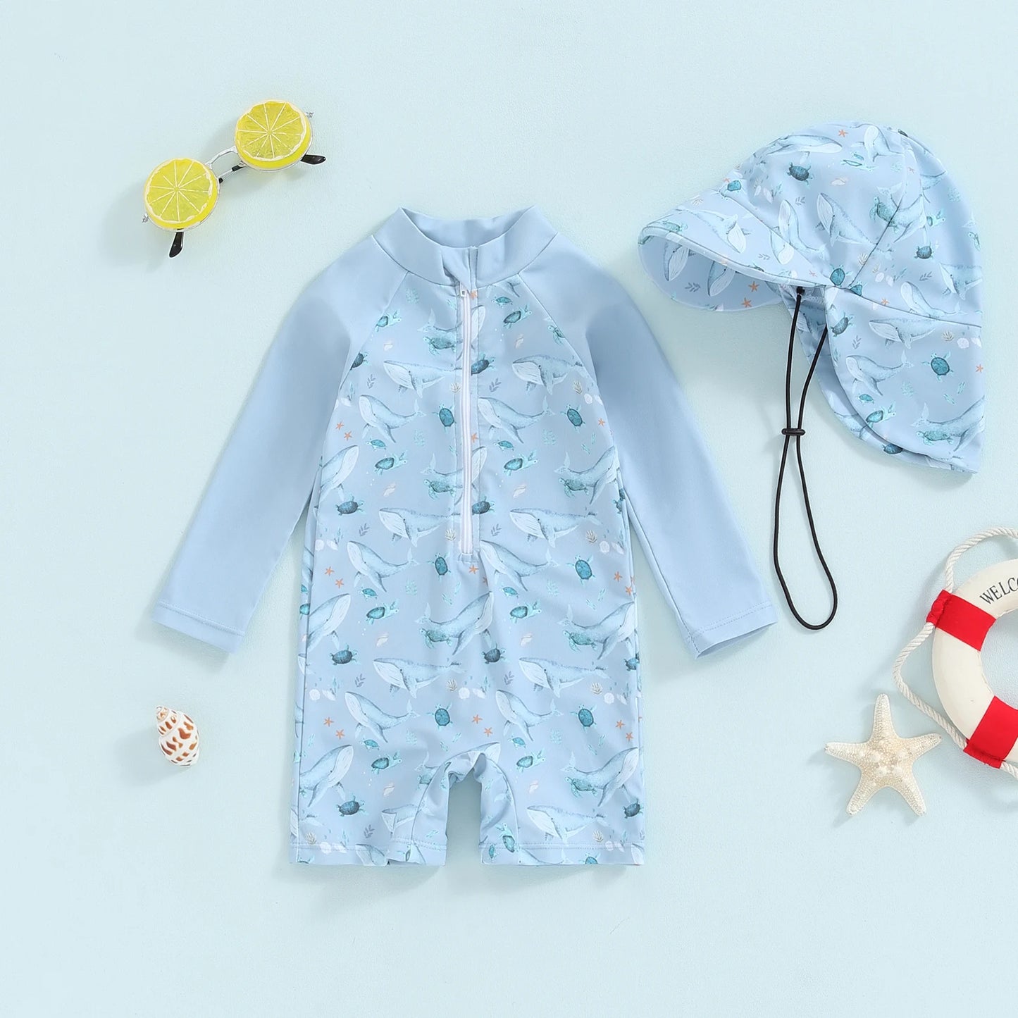 Baby long-sleeve rash guard swimsuit with shark print and matching sun hat.