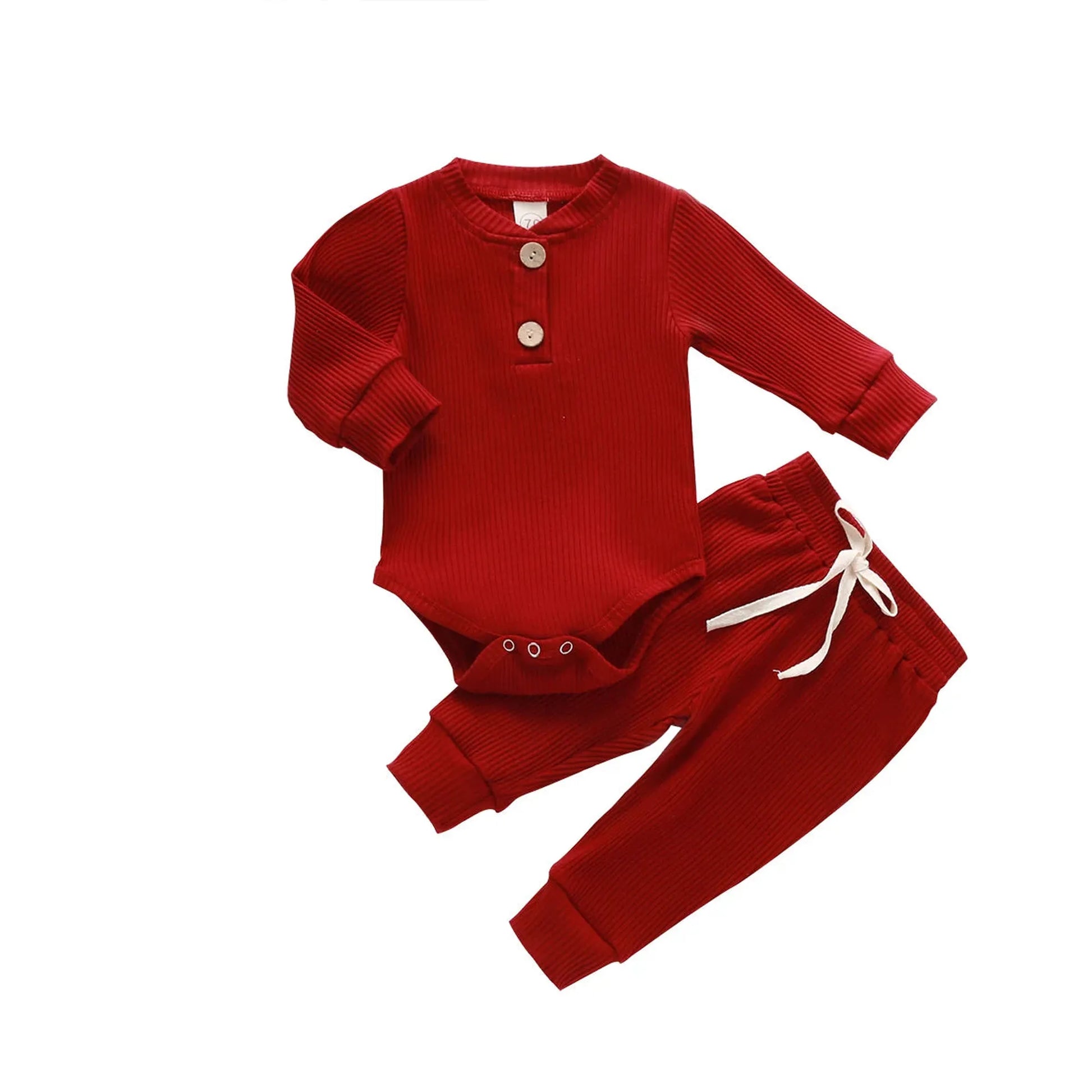 Red ribbed long-sleeve cotton baby bodysuit and matching pants with white drawstring.
