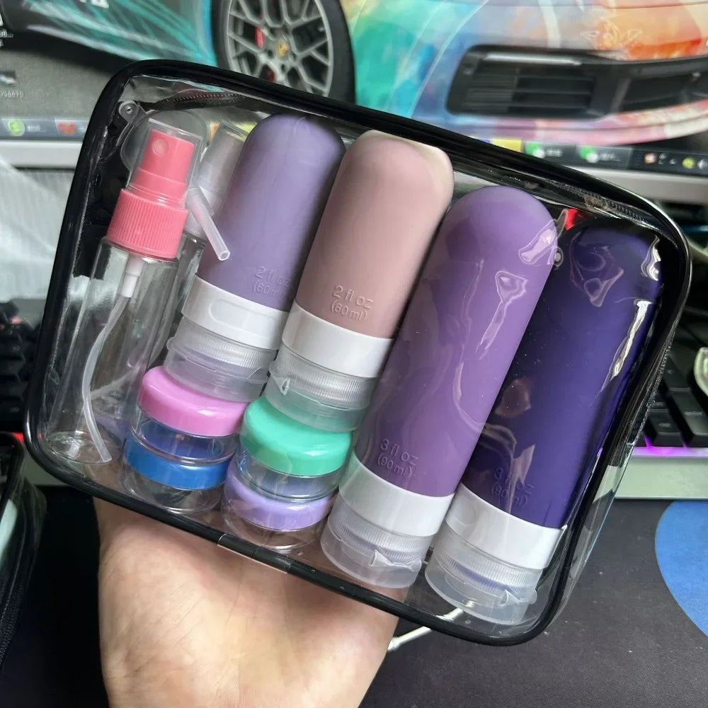 Clear travel toiletry bag with colorful silicone refillable bottles and small jars.