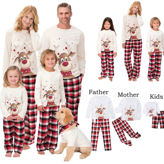 Matching family Christmas pajamas with reindeer tops and red plaid pants, including a dog outfit.
