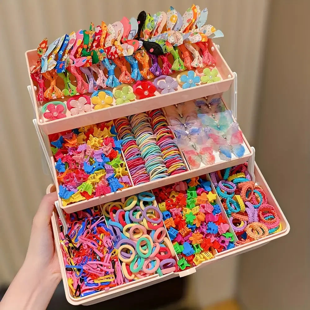 Tiered organizer filled with 555 colorful butterfly hair clips, flower clips, and elastic hair ties for girls.