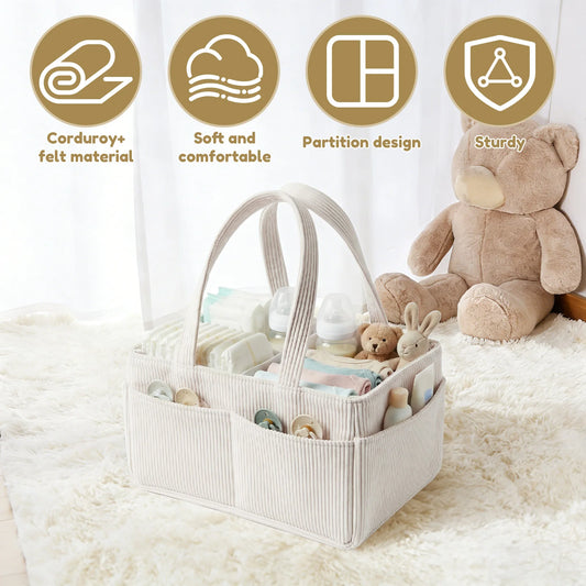 Beige corduroy baby diaper caddy with adjustable partitions, felt lining, and carry handles, holding baby essentials.