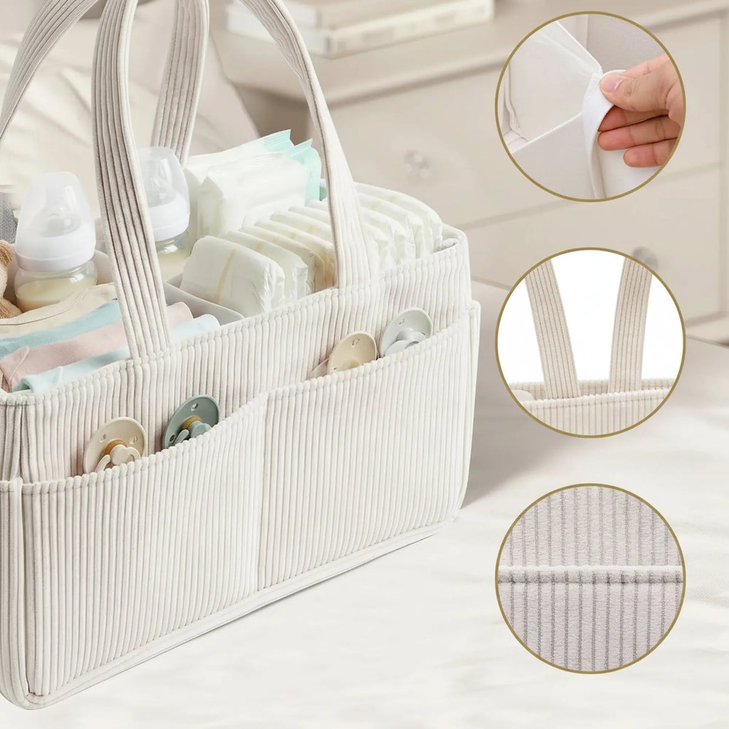 Beige corduroy diaper caddy with internal dividers, outer pockets, and long handles, filled with baby essentials.