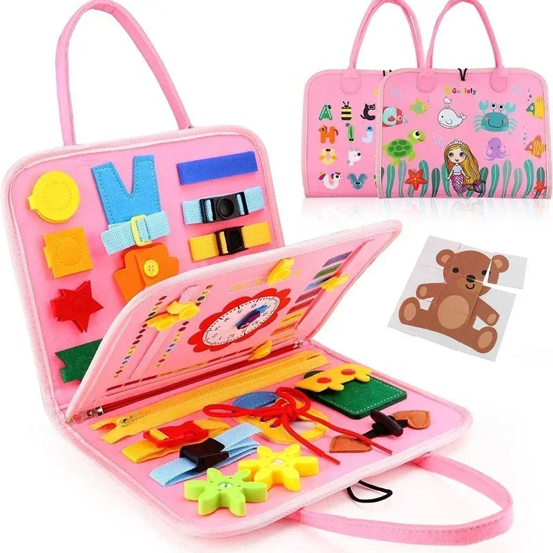 Pink felt Montessori busy board for kids with buckles, zippers, and animal puzzles.