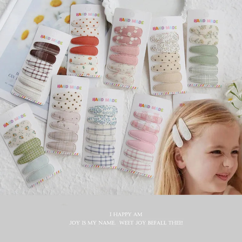 Handmade cotton hair clips for babies and girls, 6-piece sets in various pastel colors and patterns.