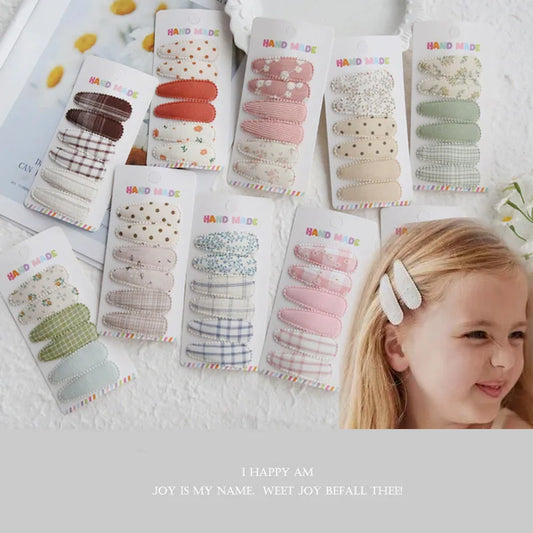 Handmade cotton hair clips for babies and girls, 6-piece sets in various pastel colors and patterns.
