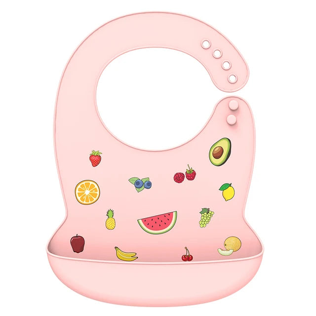 Pink silicone baby bib with colorful fruit designs and adjustable neck closure.