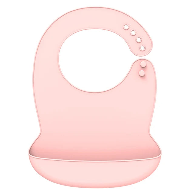 Soft pink silicone baby bib with adjustable neck and deep food-catching pocket.