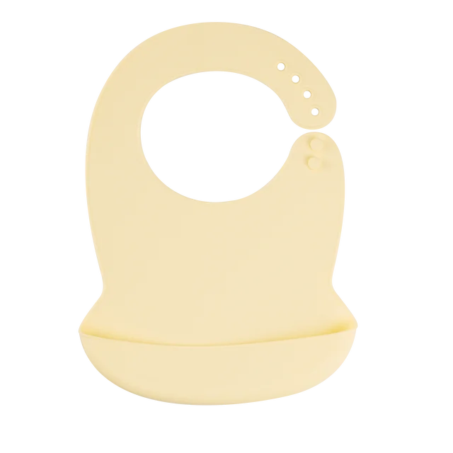 Soft cream silicone baby bib with adjustable neck and deep food-catching pocket.