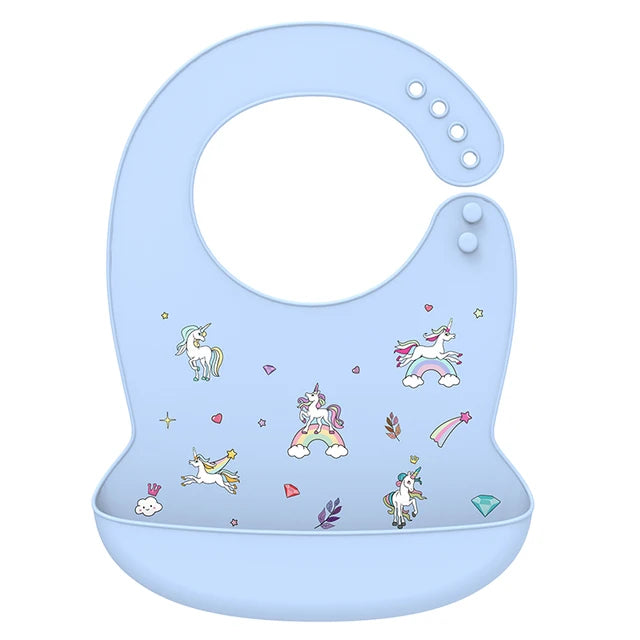 Soft blue silicone baby bib with adjustable neck and deep catch-all pocket, featuring colorful unicorn and rainbow designs.