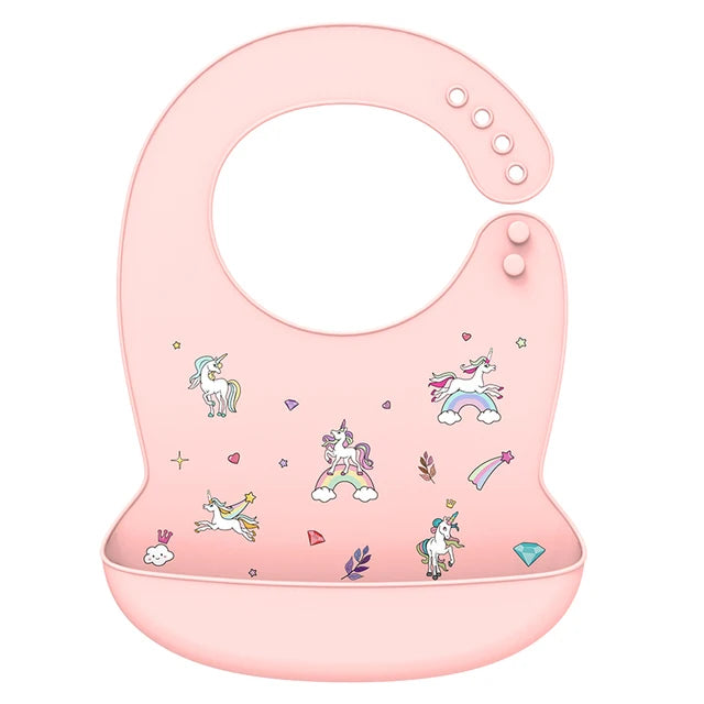 Pink silicone baby bib with adjustable neck and deep catch-all pocket, featuring colorful unicorn designs.