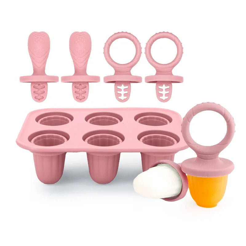 Pink silicone reusable baby popsicle mold with 6 cells and various handles, including one filled with fruit puree.