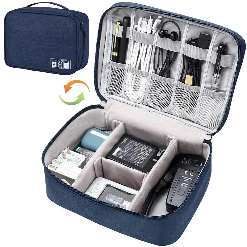 Navy blue waterproof oxford fabric electronics organizer bag, open to show cables, chargers, and accessories.