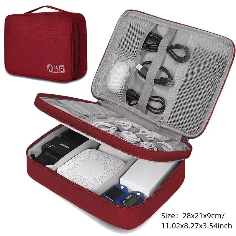 Red waterproof Oxford fabric electronic organizer bag, open to show cables and devices, with a closed bag in the background.