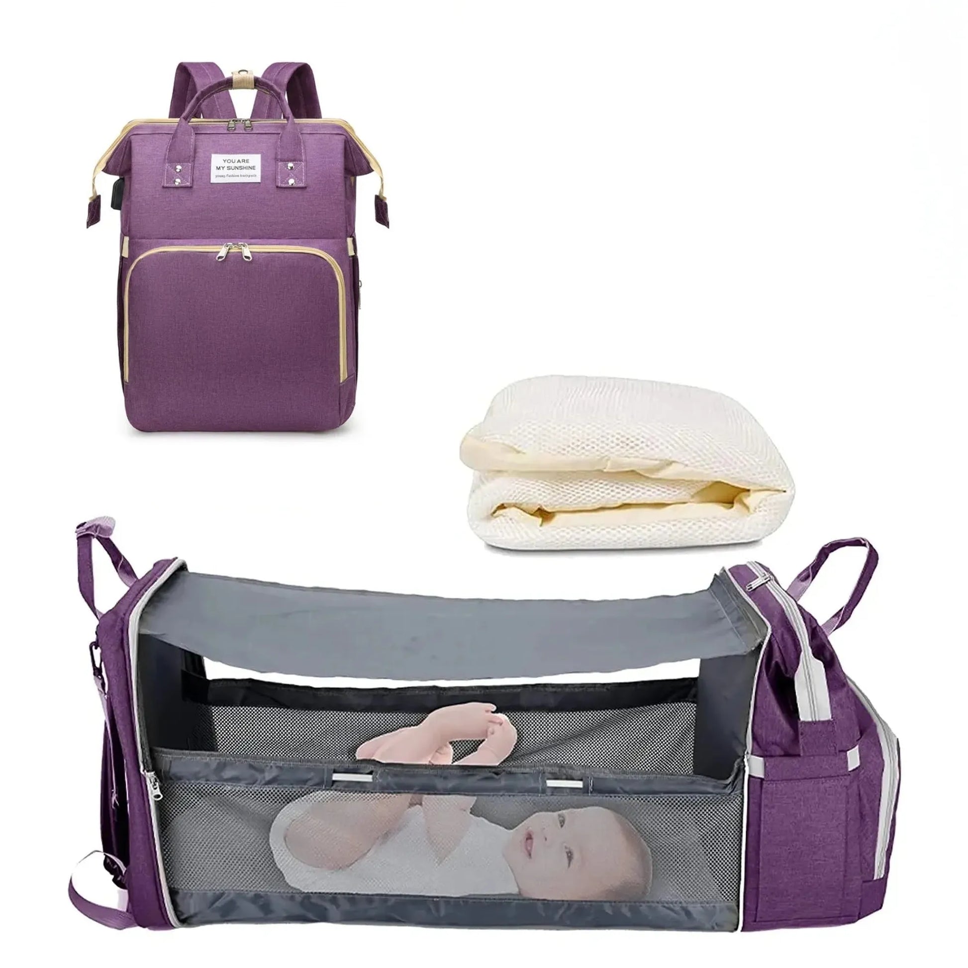 Purple 3-in-1 diaper backpack with a foldable baby bed and changing station, shown with a baby inside.