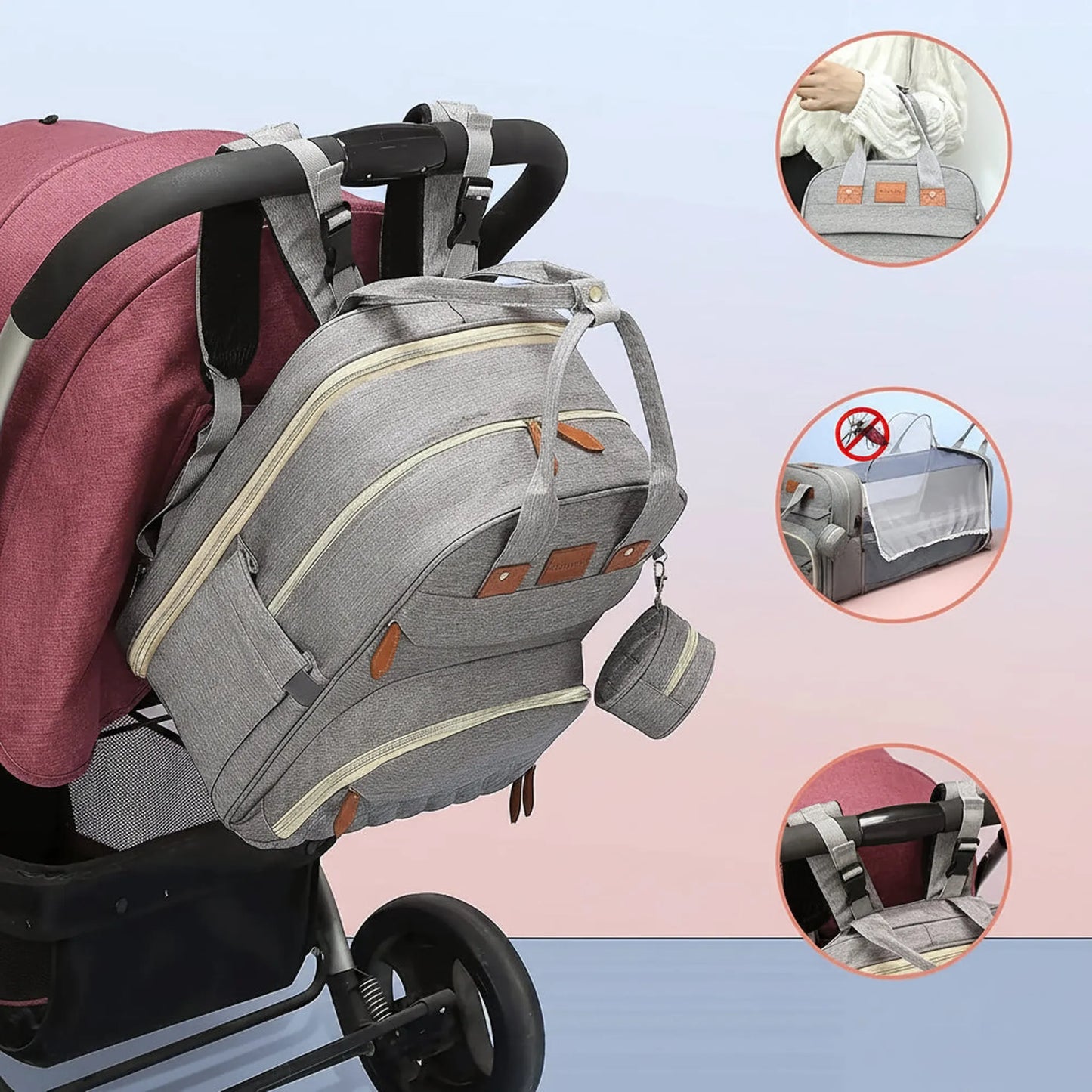 Gray 3-in-1 diaper bag with foldable bed and changing station, attached to a stroller.