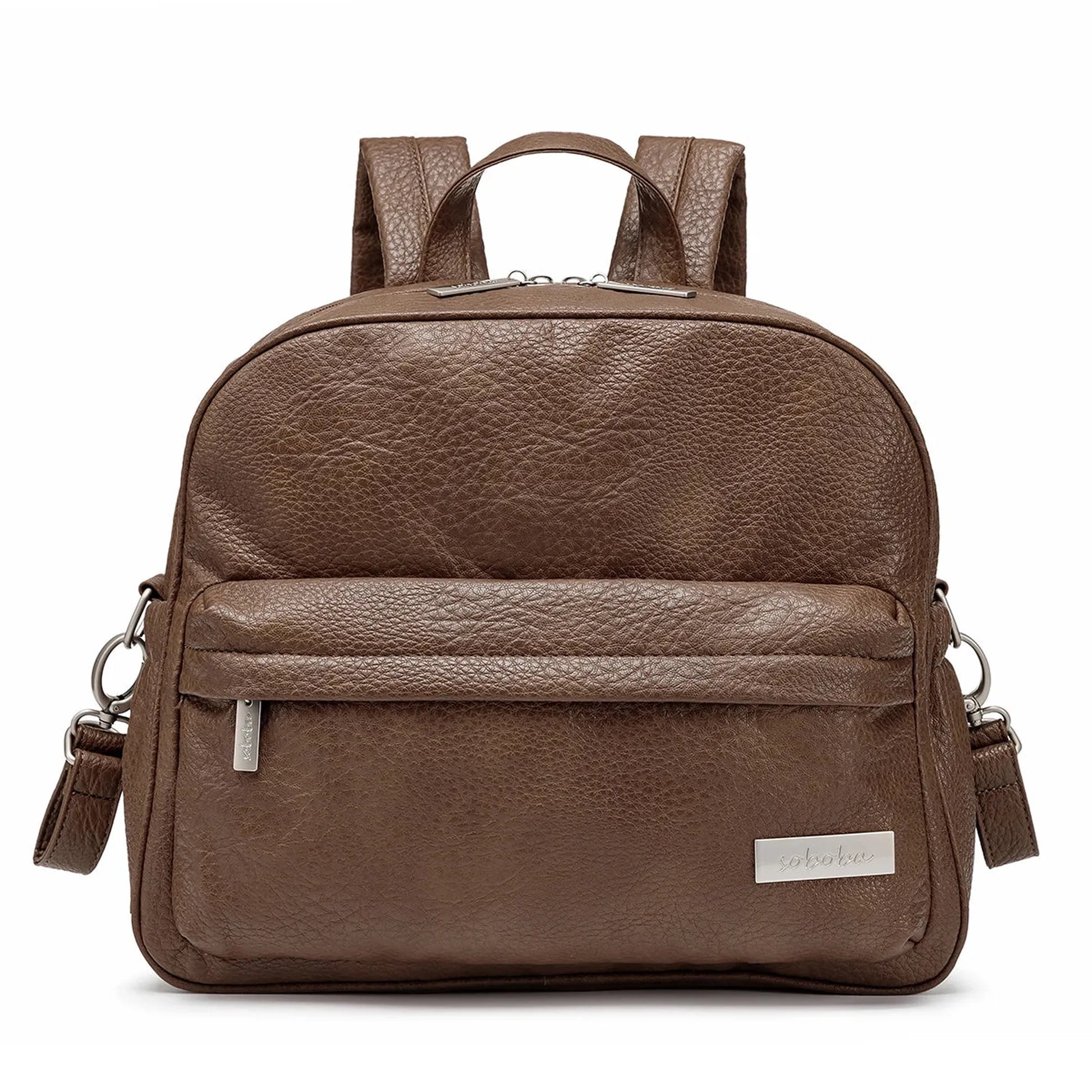 Brown faux leather diaper backpack with front pocket, top handle, and adjustable straps.