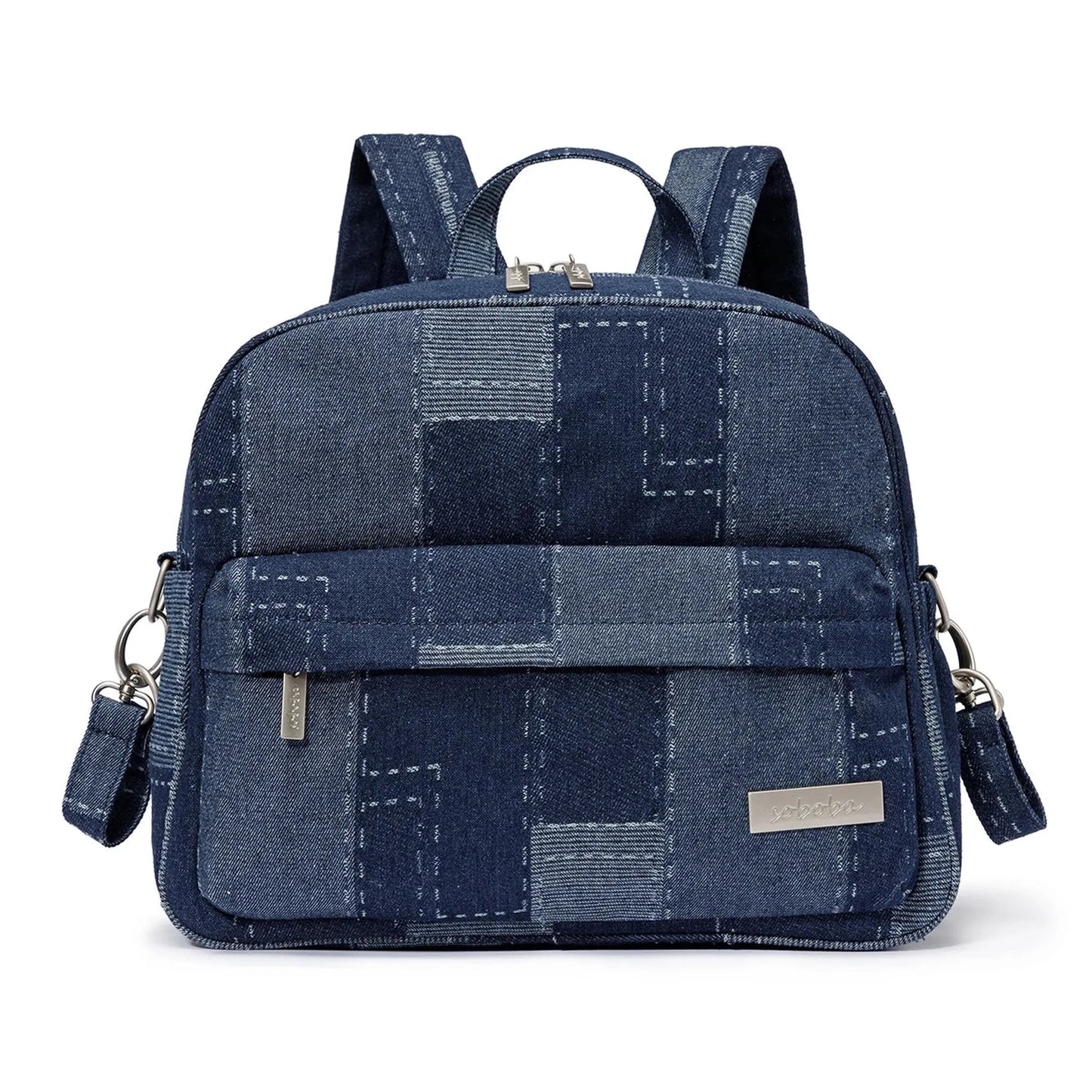 Stylish blue denim patchwork diaper backpack with silver zippers and adjustable straps.