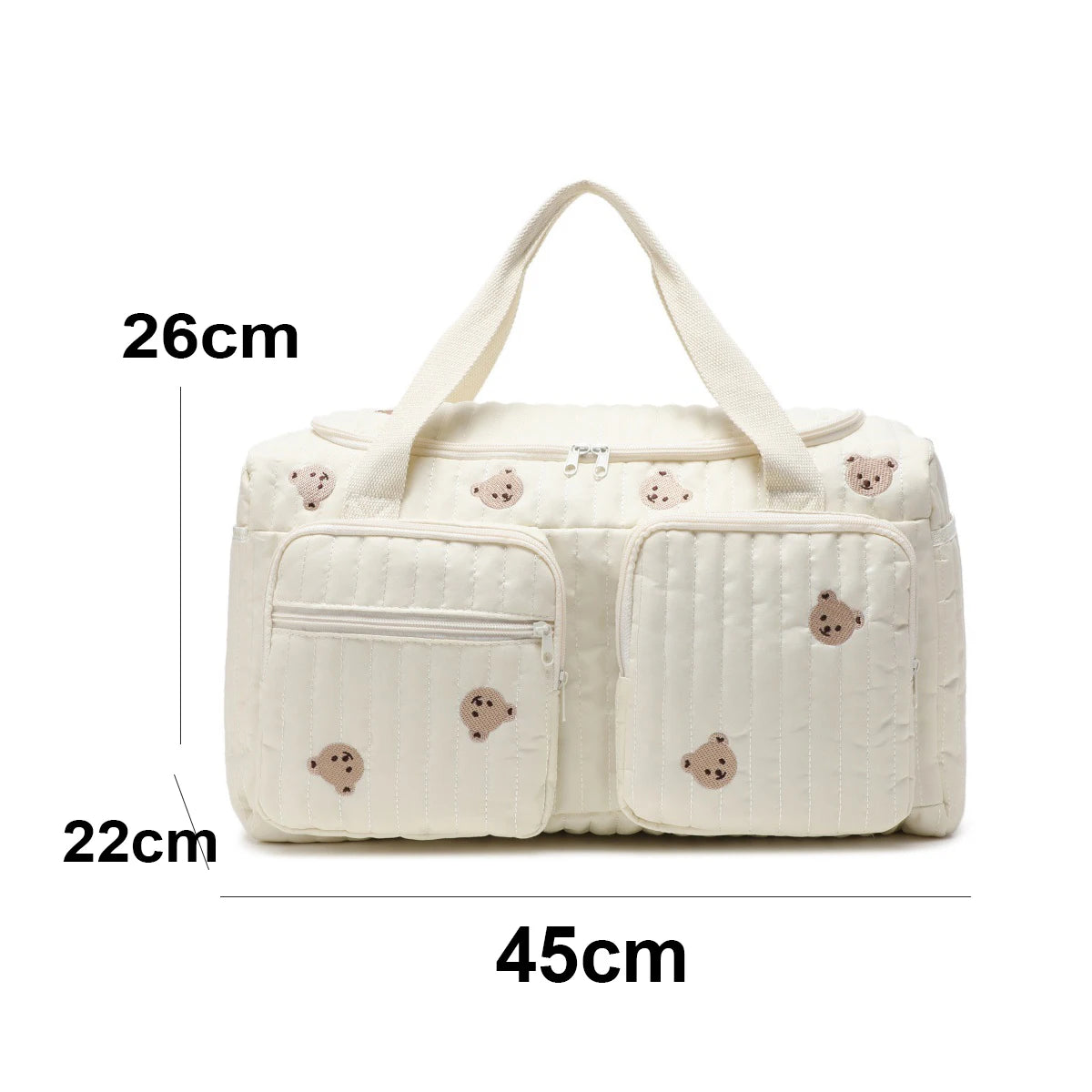 Cream quilted cotton diaper bag with embroidered teddy bears, zipper closure, and front pockets.