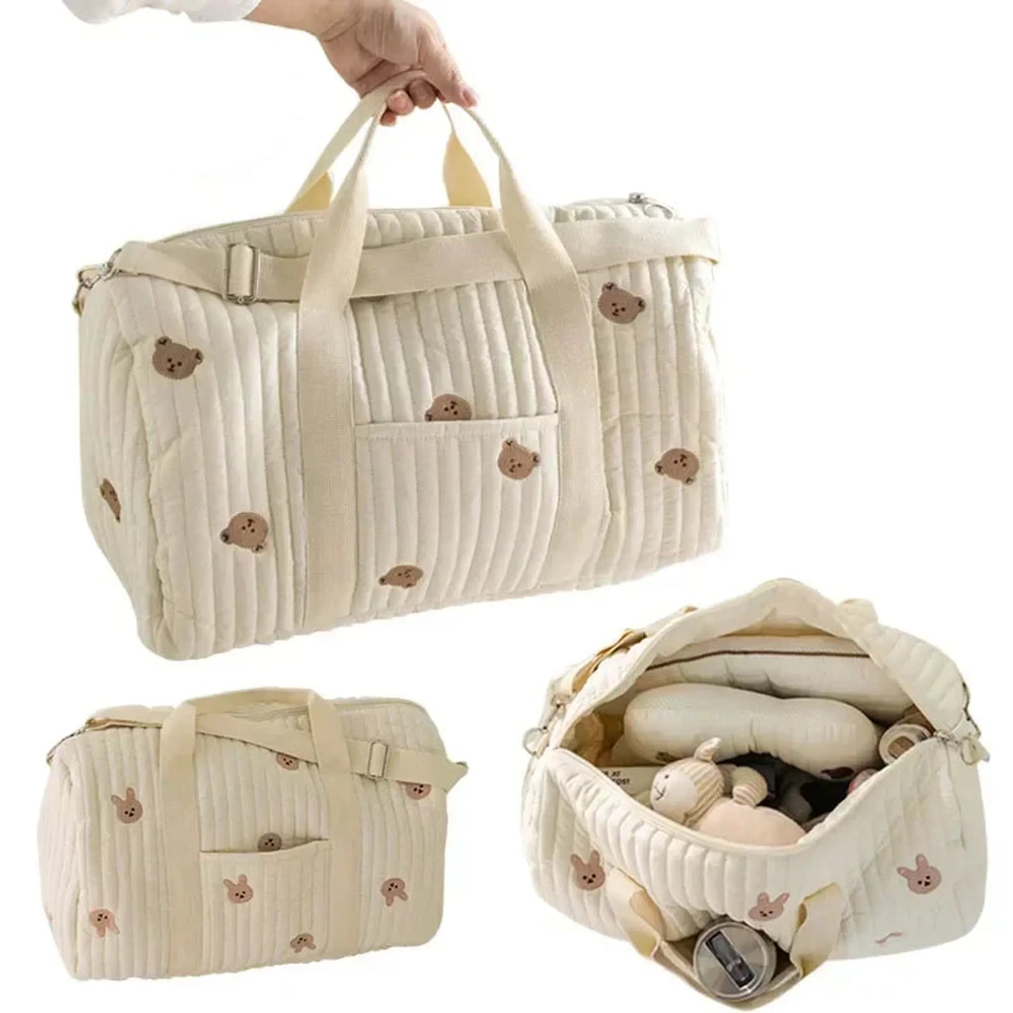 Quilted cream cotton diaper bag with bear embroidery, front pocket, and spacious interior for baby essentials.