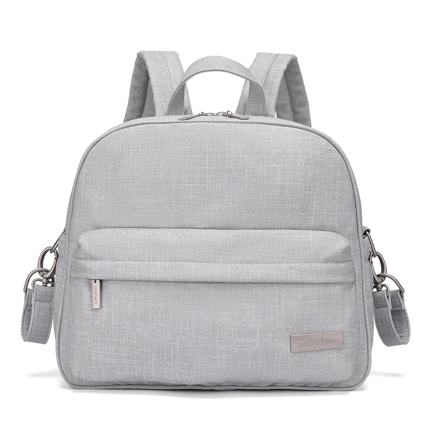 Stylish light gray diaper backpack with front pocket, top handle, and adjustable shoulder straps.
