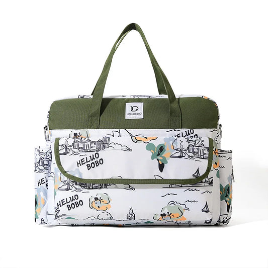 White and olive green Oxford waterproof diaper bag with playful cartoon print and multiple pockets.