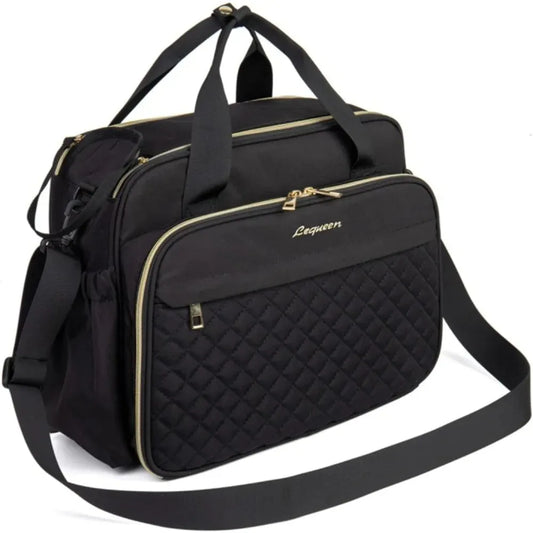 Black waterproof diaper bag with gold zippers, quilted front pocket, and adjustable shoulder strap.